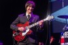 A tribute band impersonating the Beatles plays on the stage at Fox Perfoming Arts Center