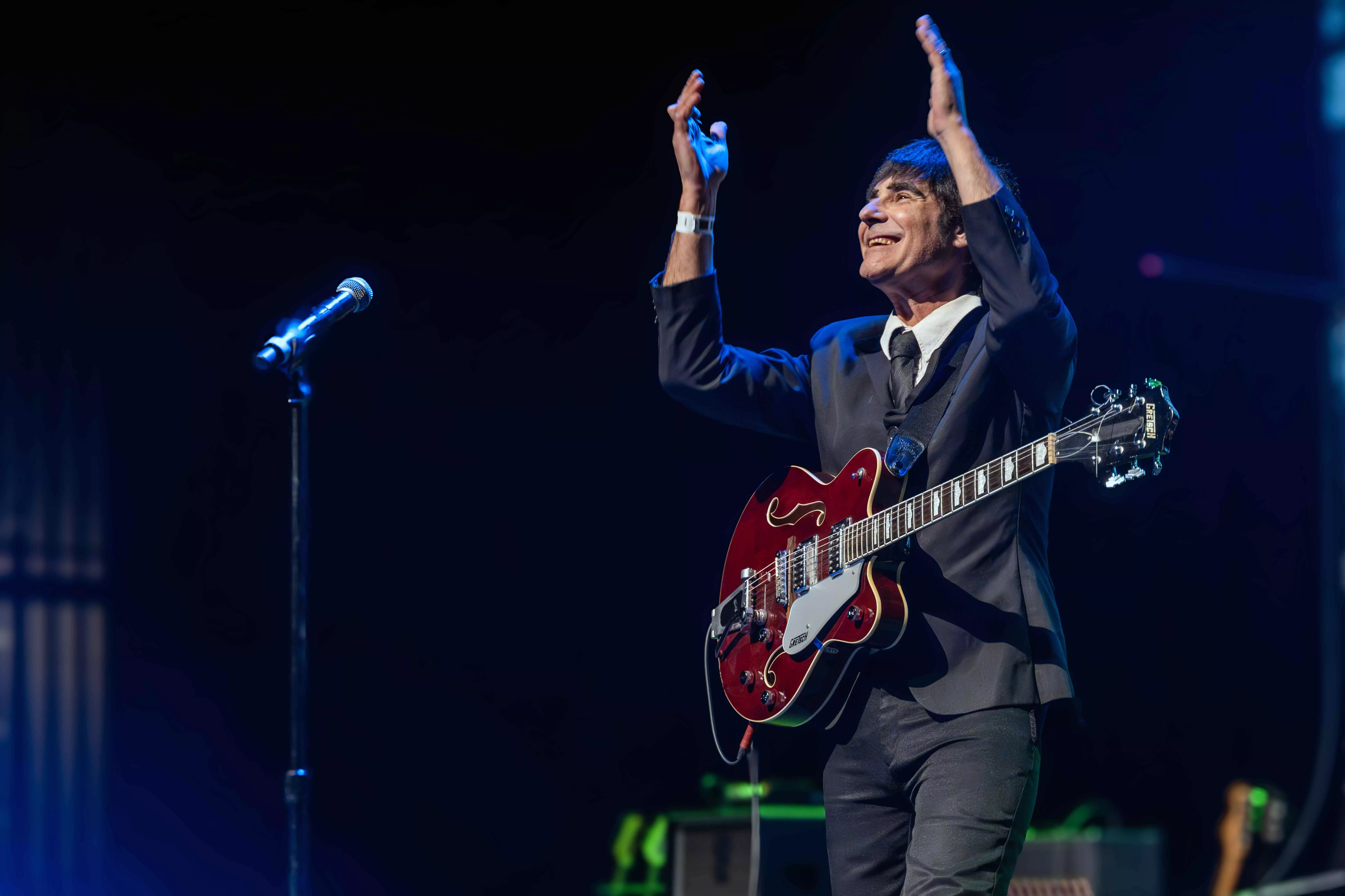 A tribute band impersonating the Beatles plays on the stage at Fox Perfoming Arts Center