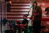 Three members of a band perform at a local restaurant and bar