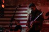 Three members of a band perform at a local restaurant and bar