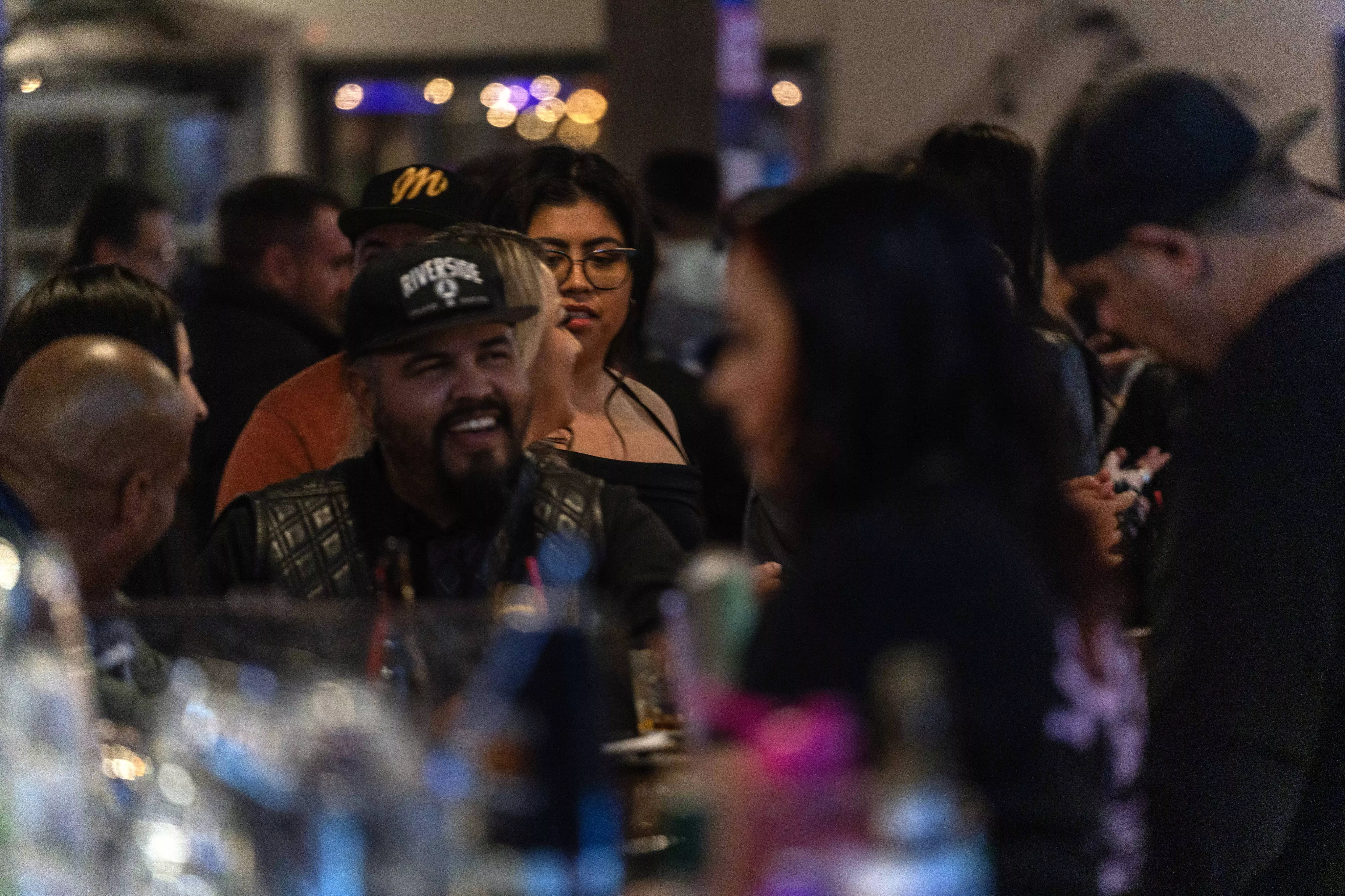 Three members of a band perform at a local restaurant and bar