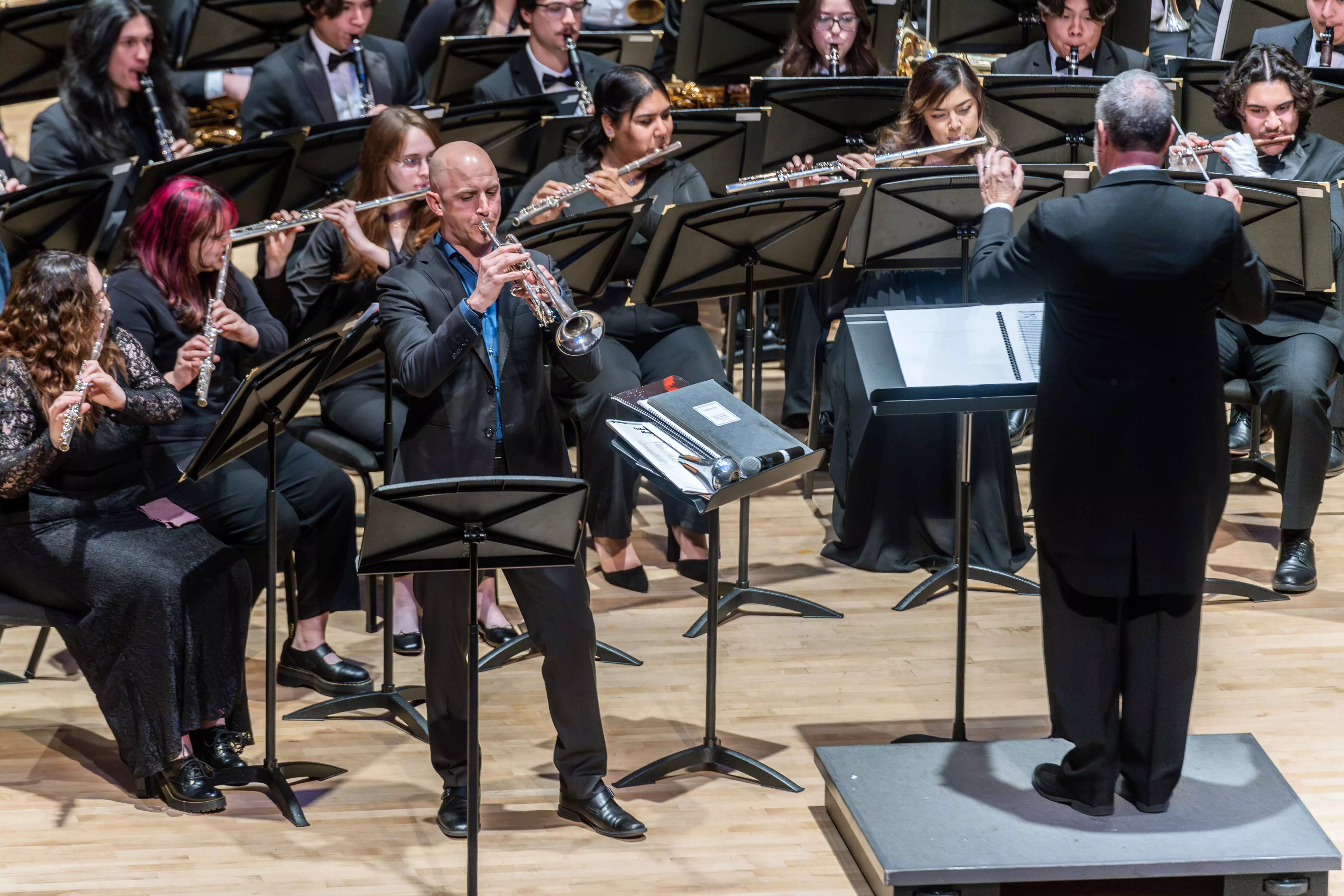 Student from Riverside City College Wind Ensemble perform on stage