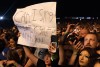 fan holds sign saying Can I sing Break Stuff with you