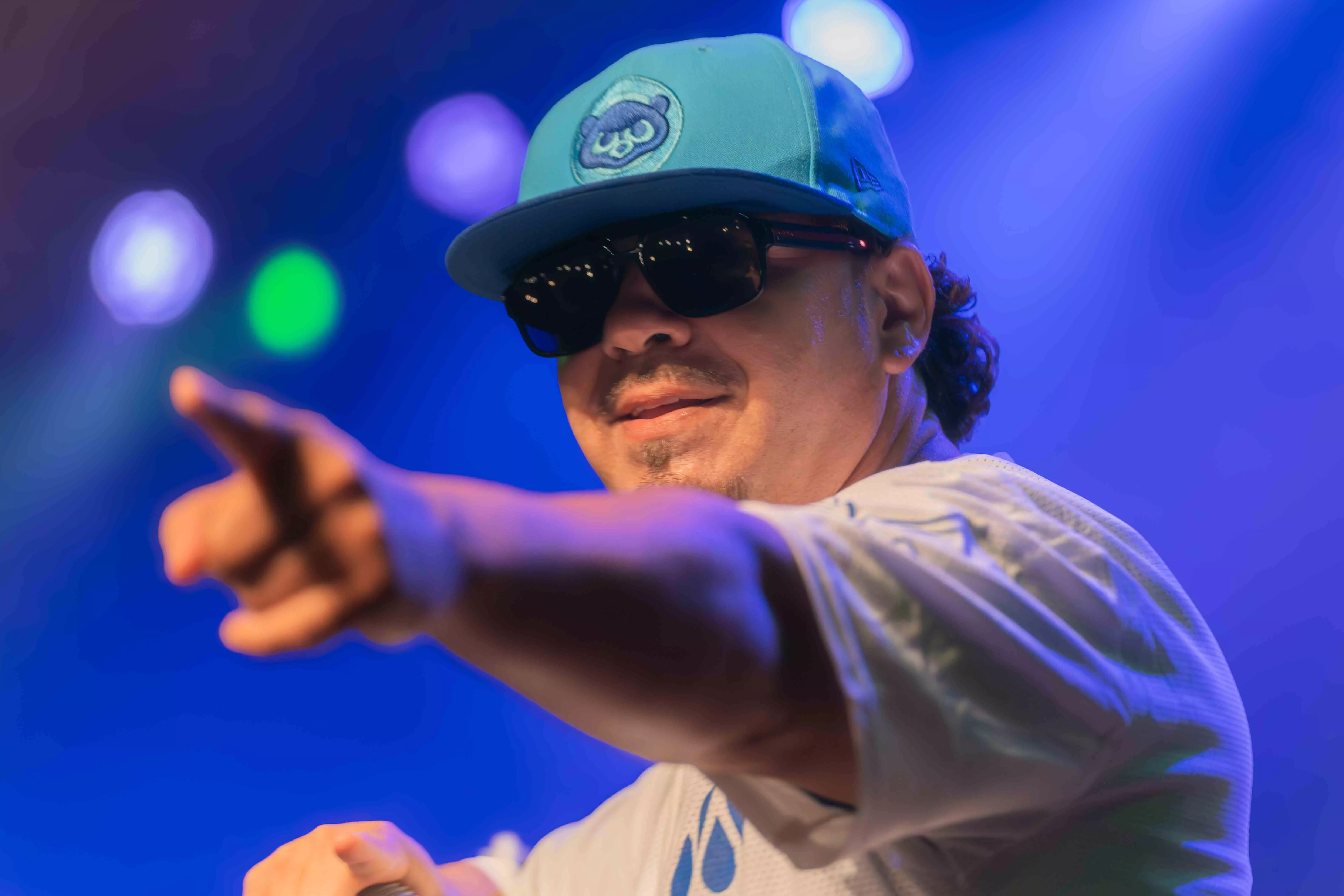 Baby Bash AKA Ronnie Rey points at a fan in the crowd during his performance at the RMA