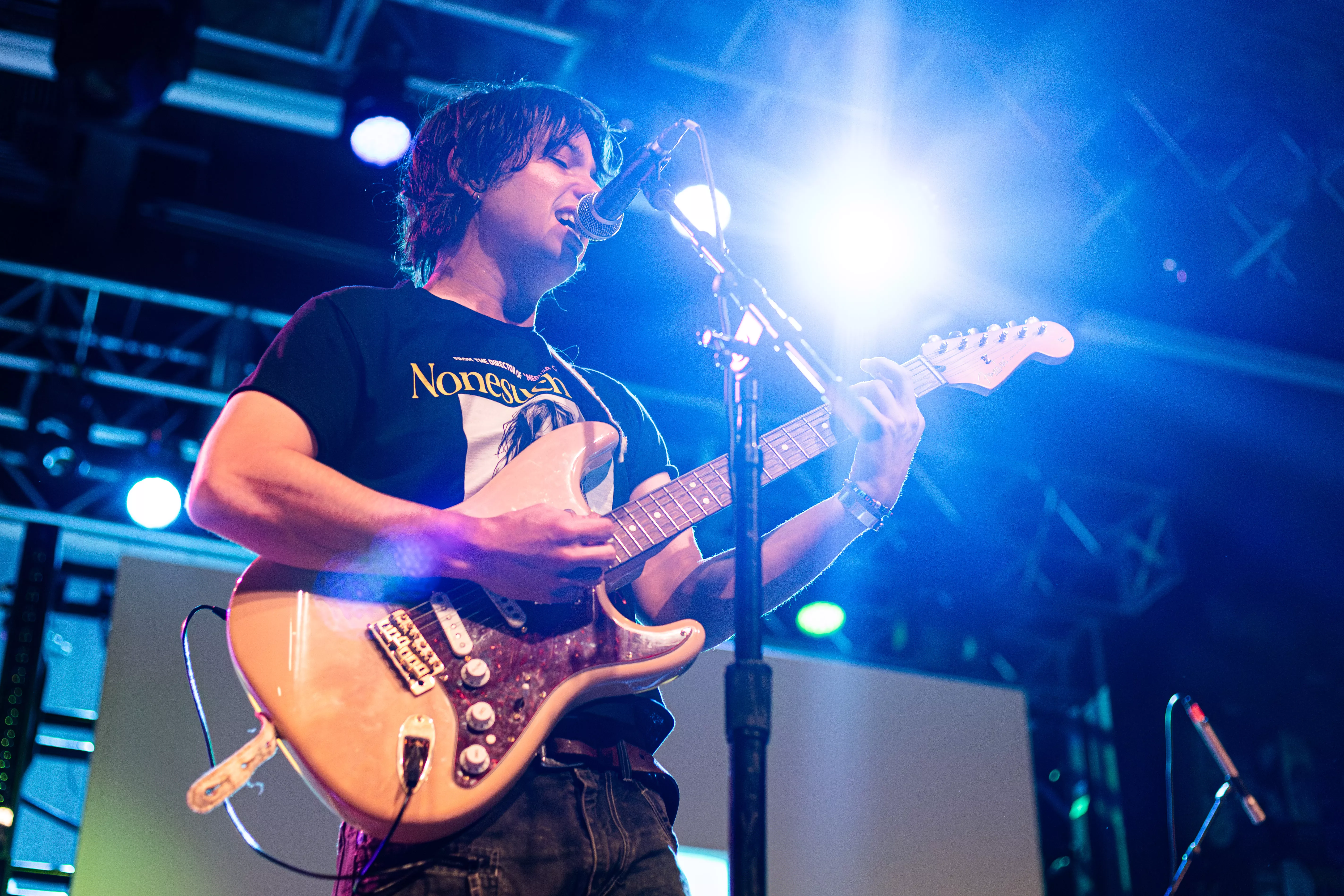 Tucker Elkins plays the guitar on stage