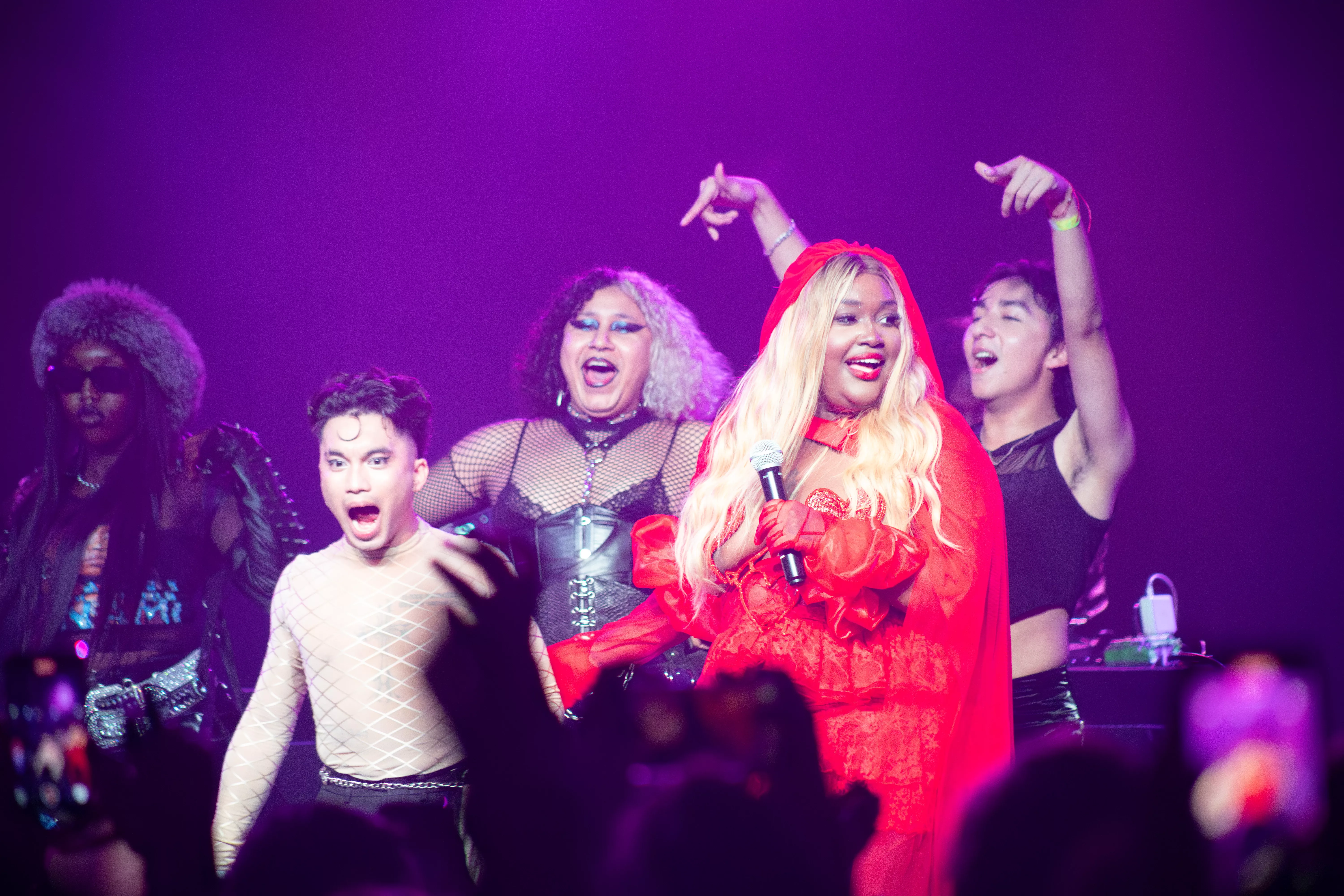 Fans and CupCakKe celebrate on stage