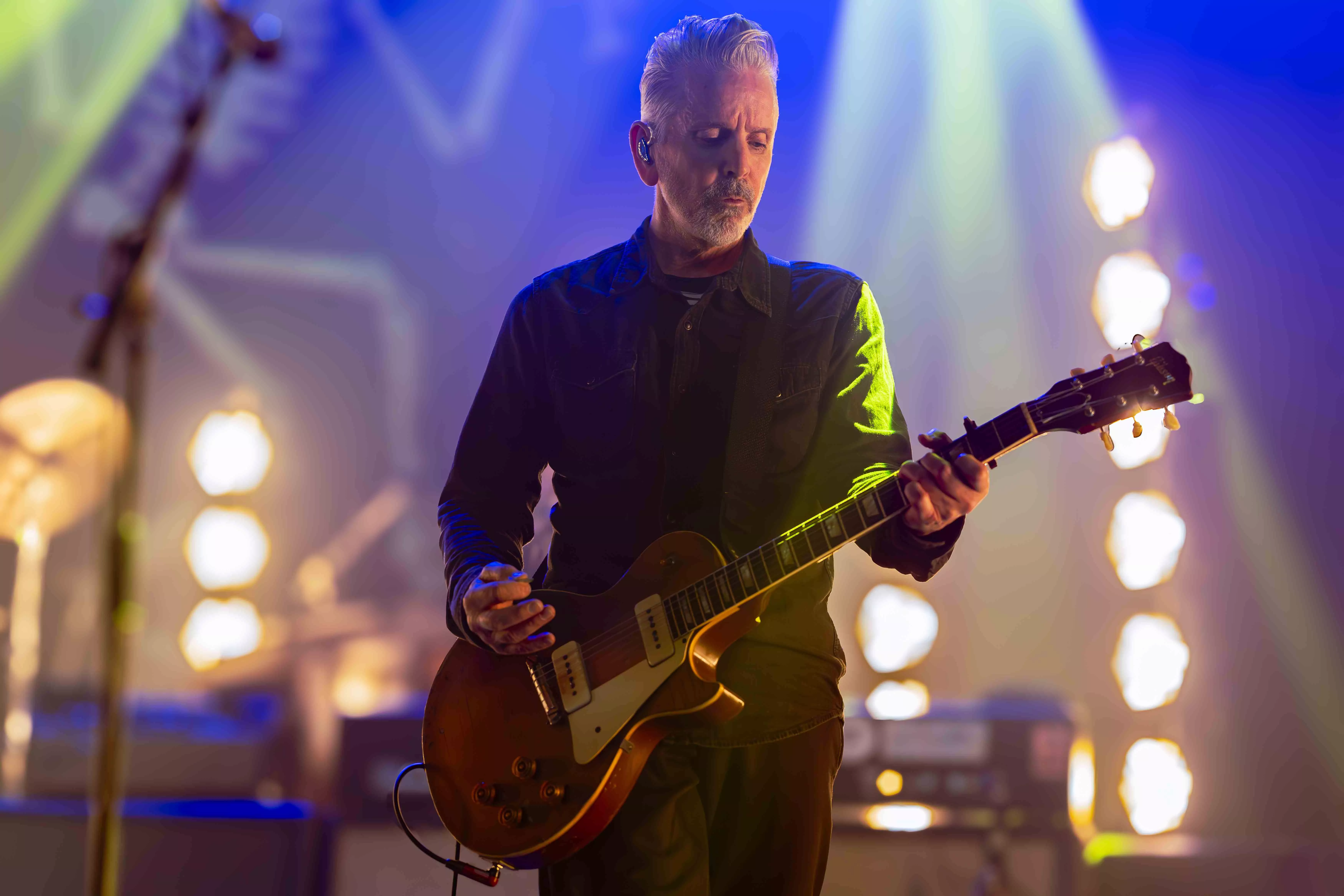 A musician performs on stage