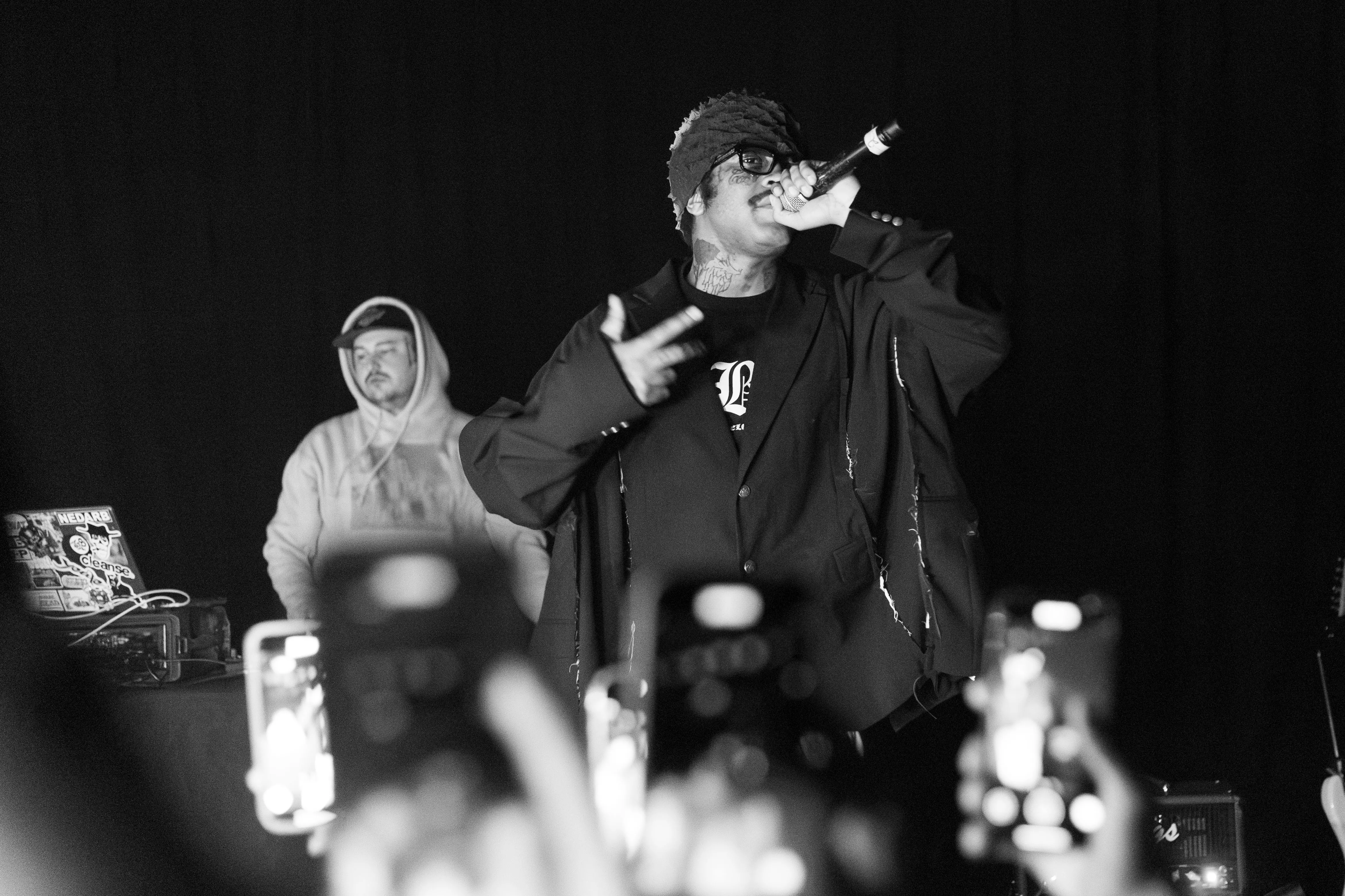 GothBoiClique members perform on stage