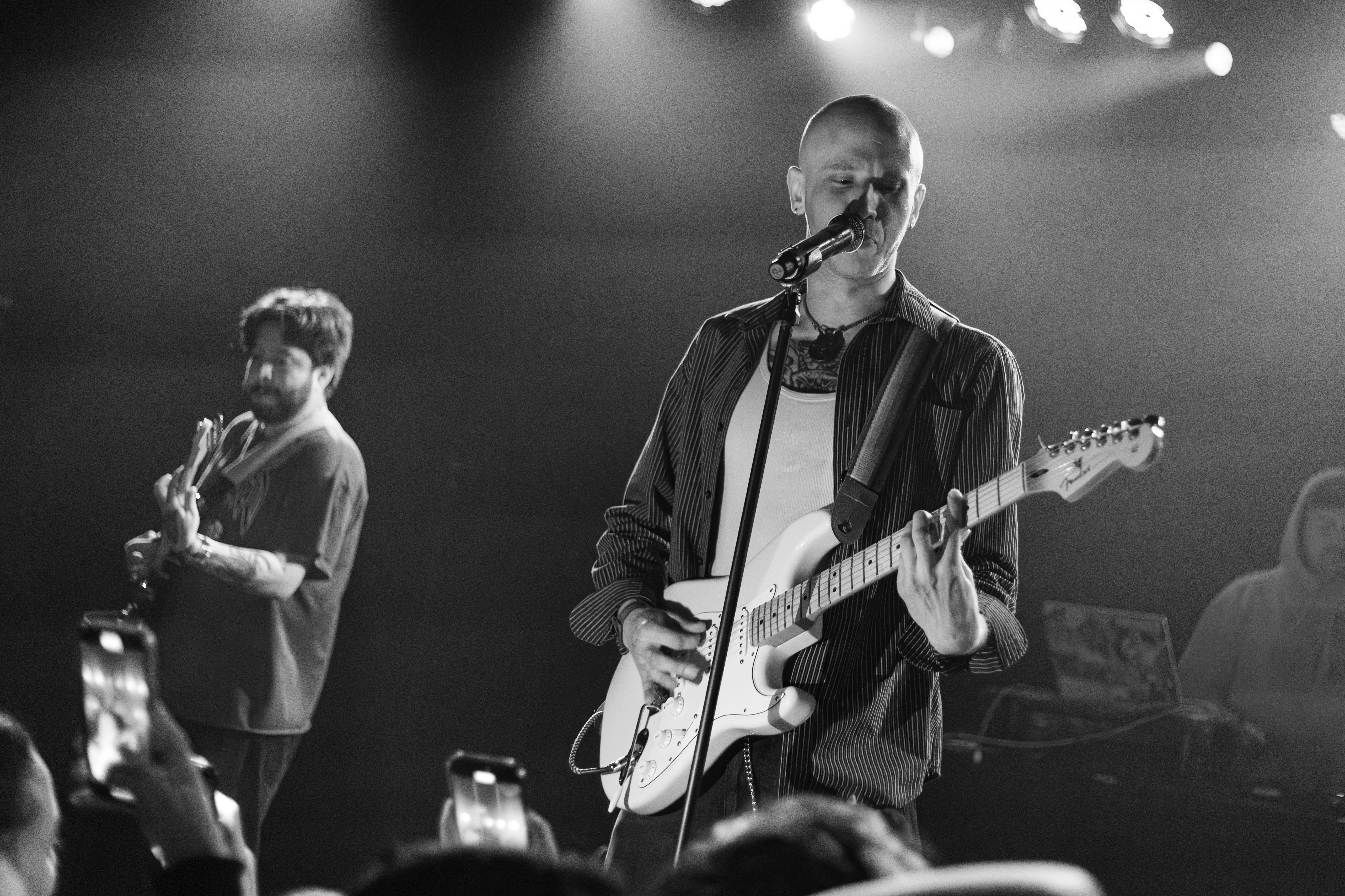 GothBoiClique members perform on stage