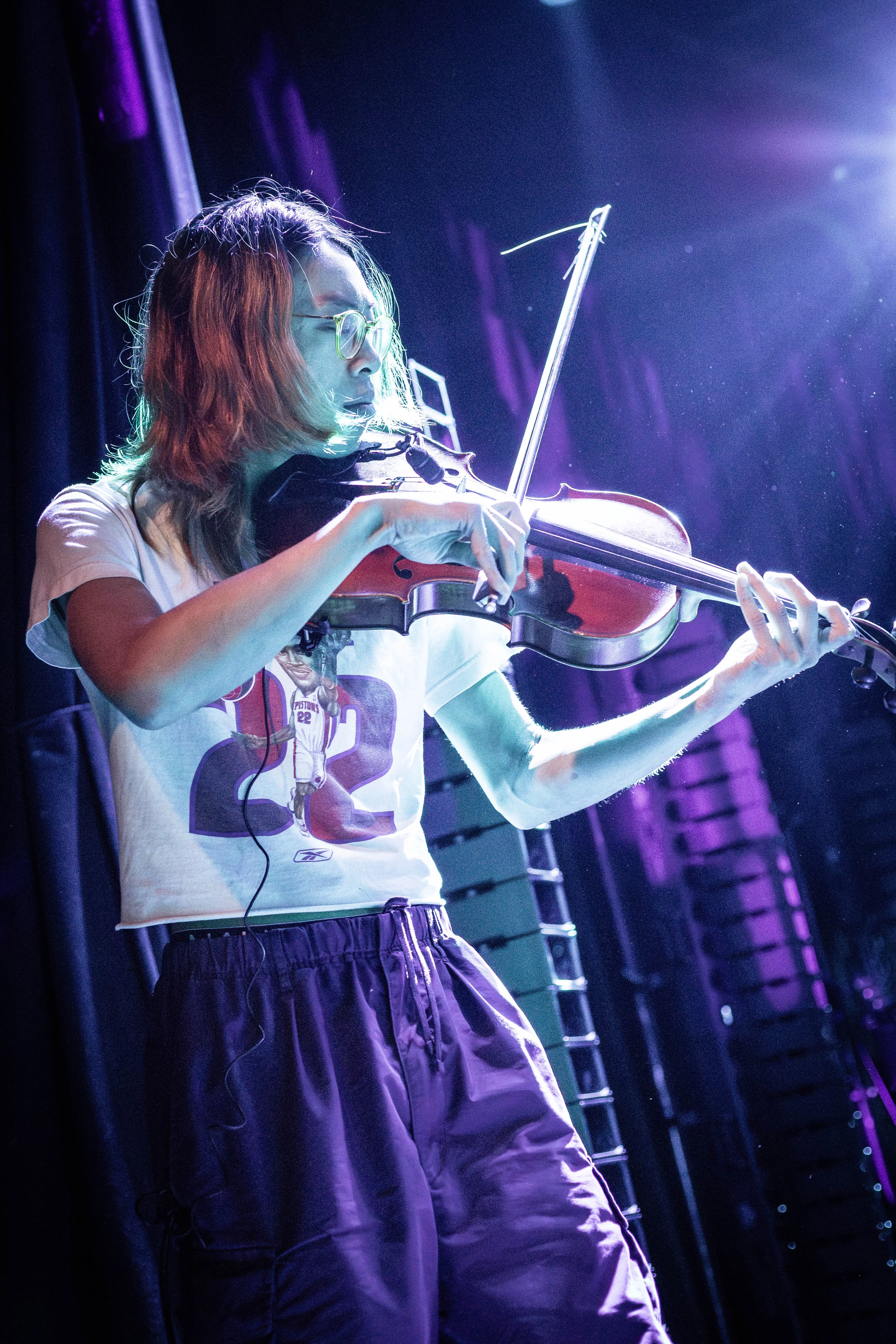 Noah Leong plays the viola while on stage