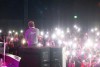 RC AVENUE performs as fans shine their phones towards him