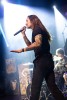Band members perform on stage