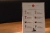 A laminated menu of drink and cocktail items from Wolfskill