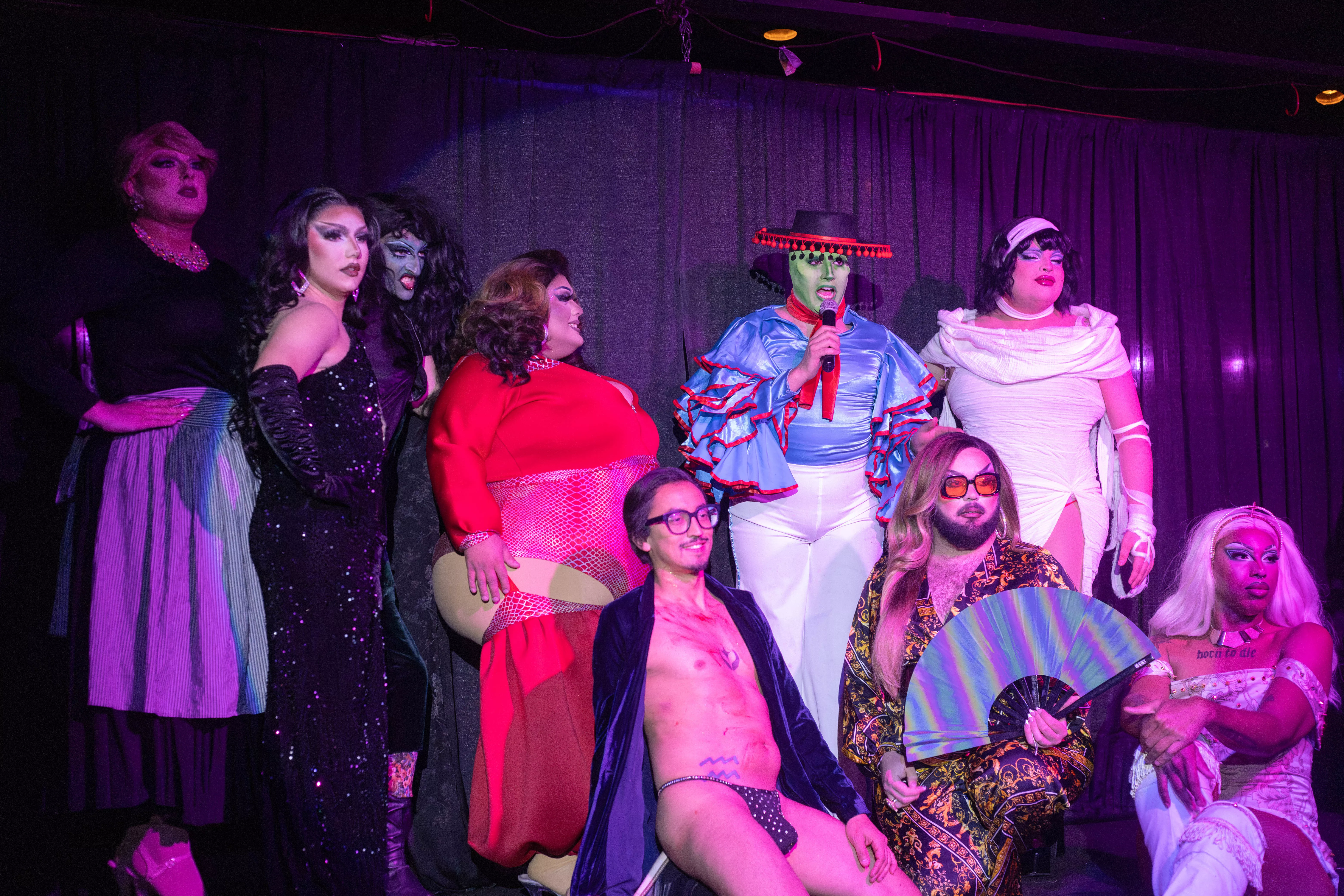 Drag entertainers line up on stage after the show