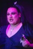 A Drag Queen performs on stage