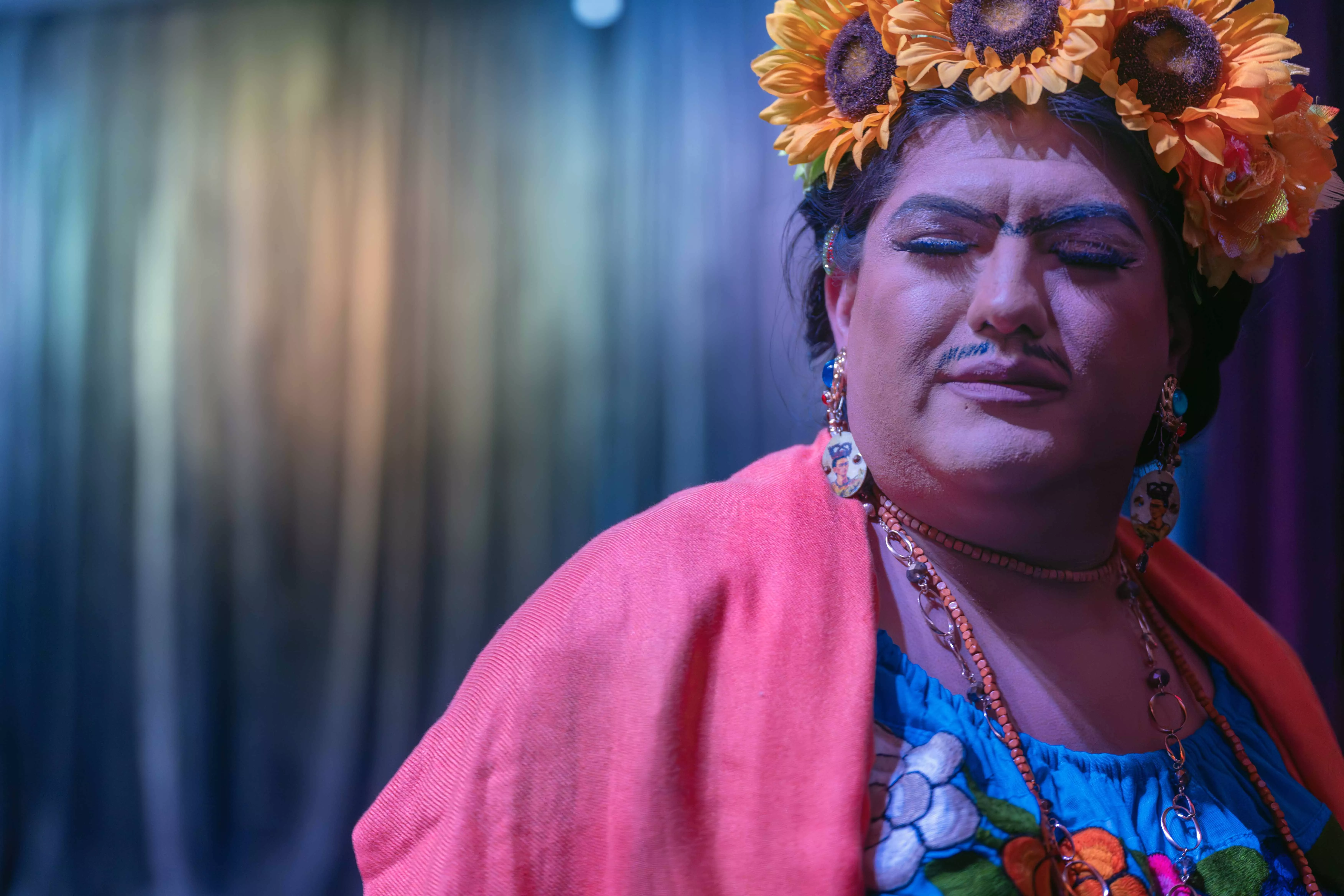 A drag queen working through the crowd in a gay bar