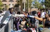 Parade marchers take part in the Black History Month parade