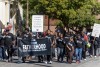 Parade marchers take part in the Black History Month parade