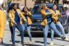 Parade marchers take part in the Black History Month parade