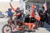 Parade marchers take part in the Black History Month parade