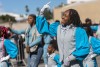 Parade marchers take part in the Black History Month parade