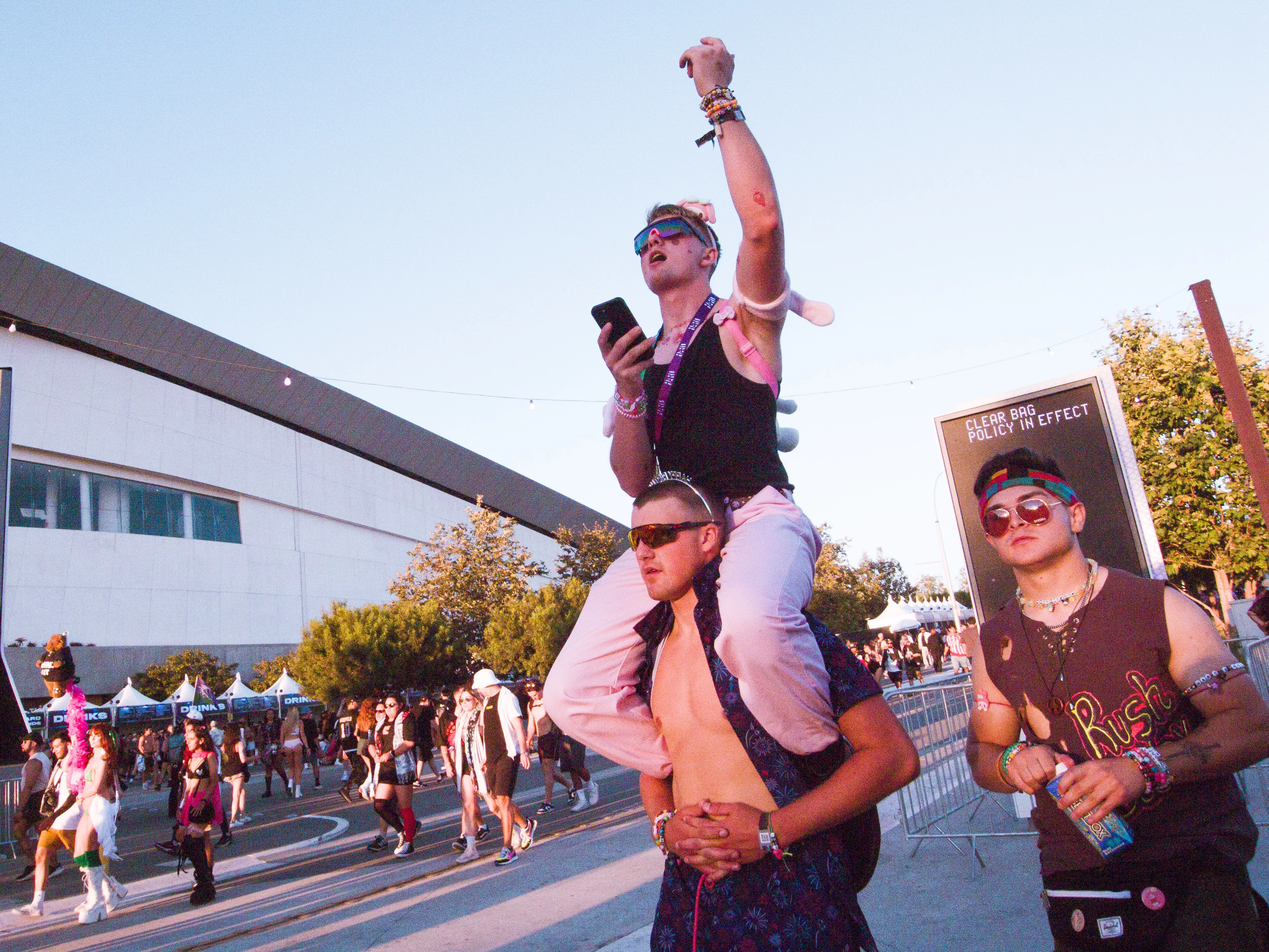 A person hitching a ride on the shoulders of their friend as they walk at Hard Summer at Hollywood Park in Inglewood Ca on August 3rd 2024