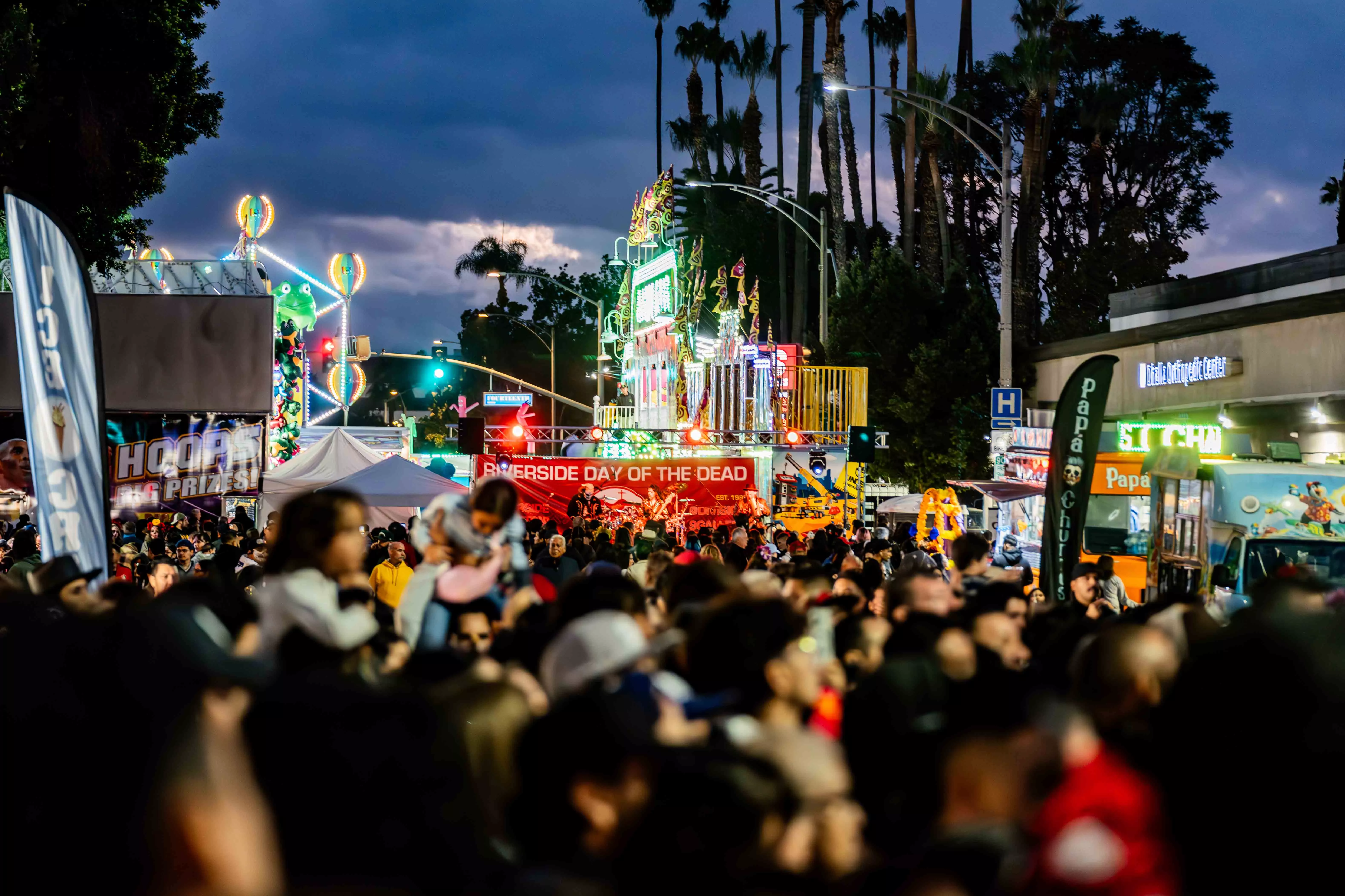 Celebrants enjoy the Downtown Riverside Day of the Dead festival in Riverside, CA