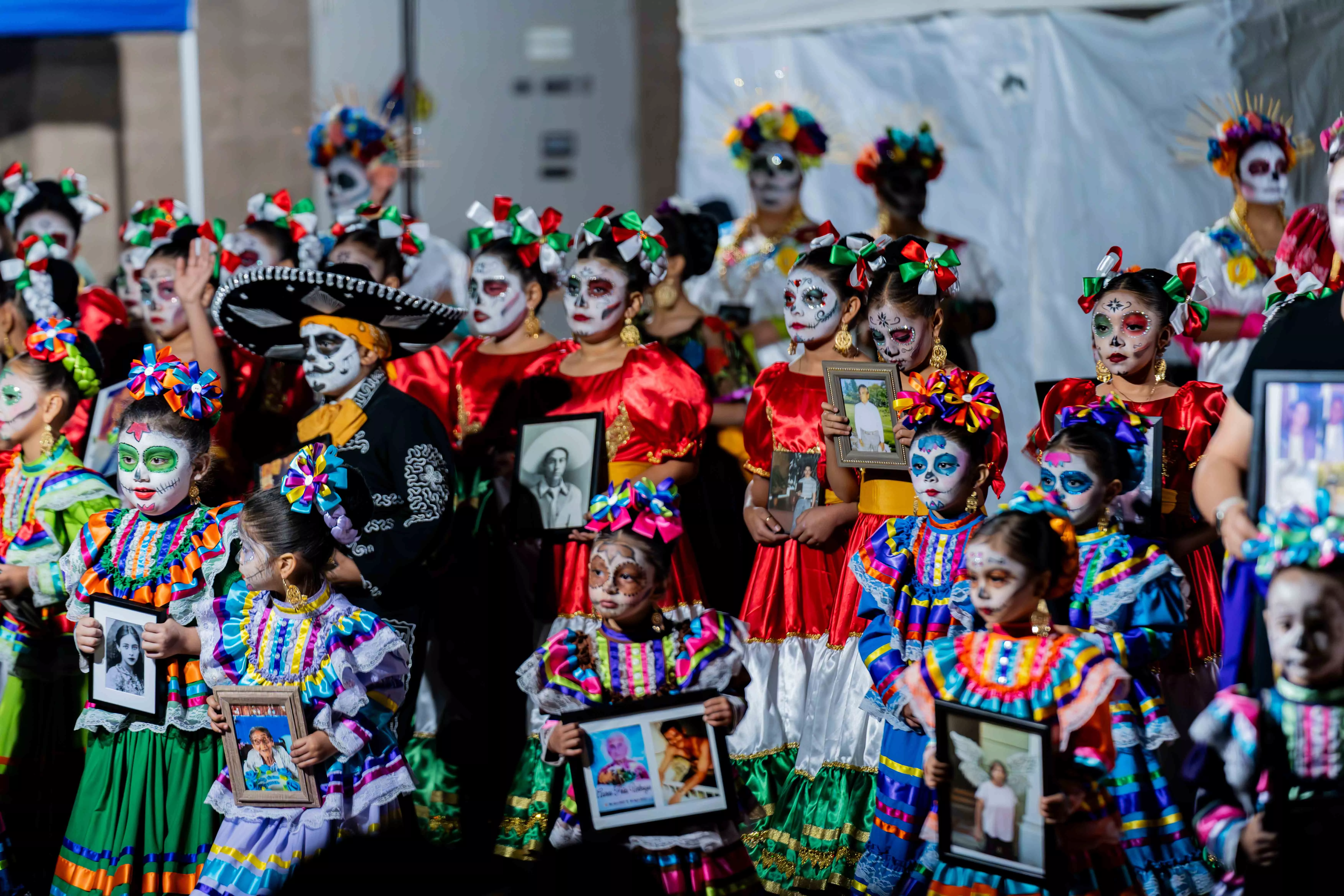 Celebrants enjoy the Downtown Riverside Day of the Dead festival in Riverside, CA