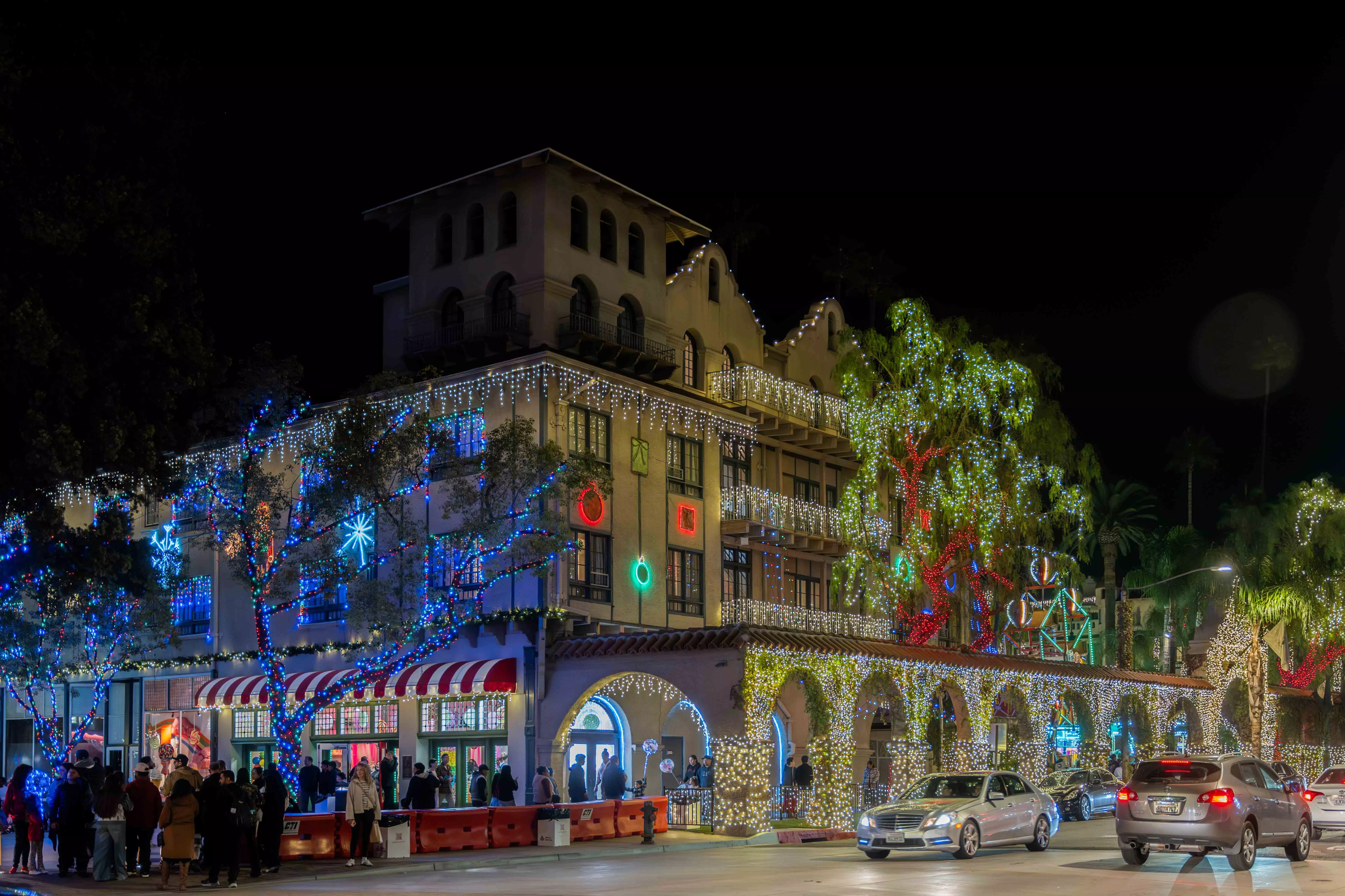 A hotel decorated with millions of christmas lights light up the street in Downtown Riverside