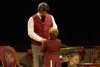 Man greets a little boy as he is invited over for a party