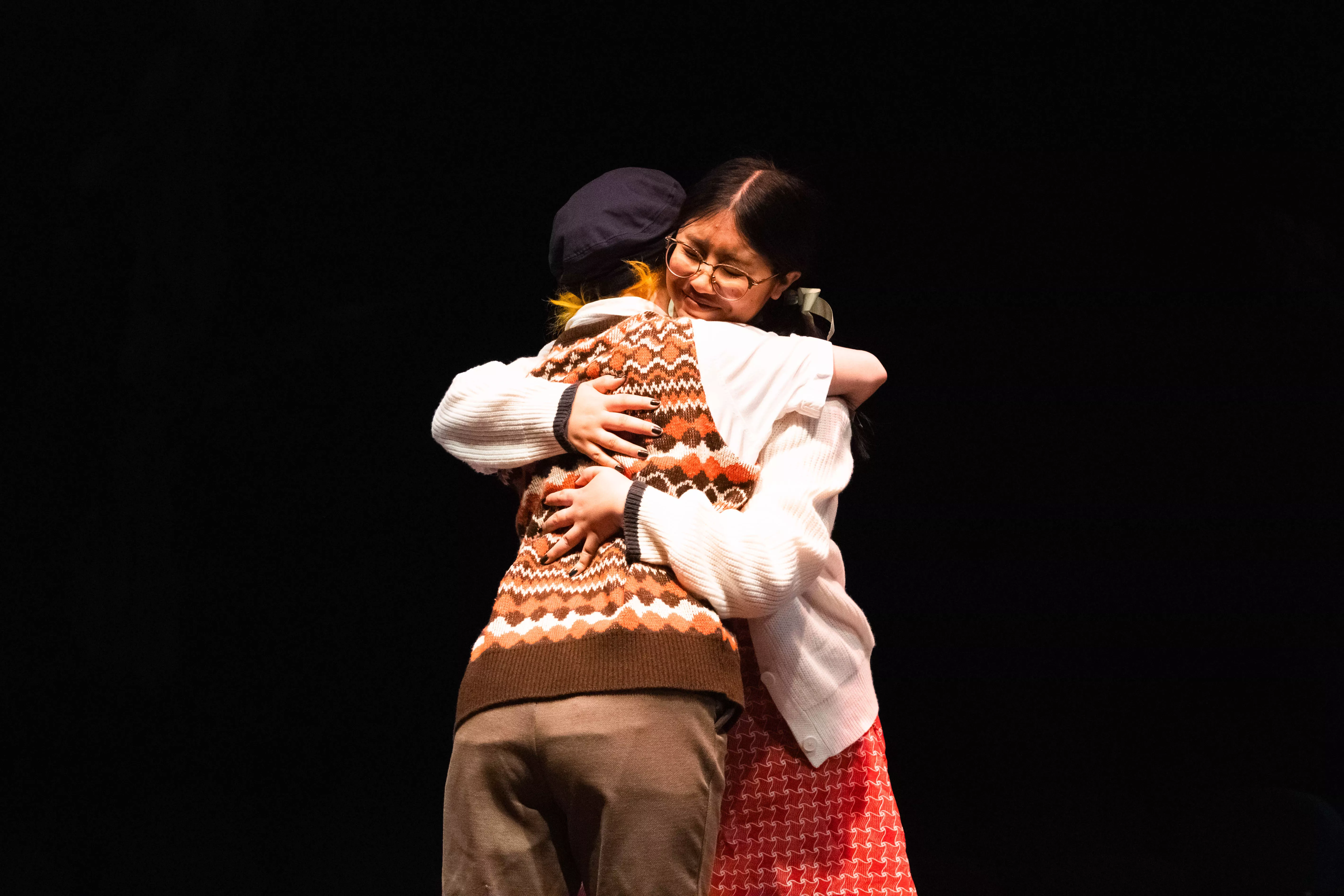 Indie Locke and Piper Joven perform on stage